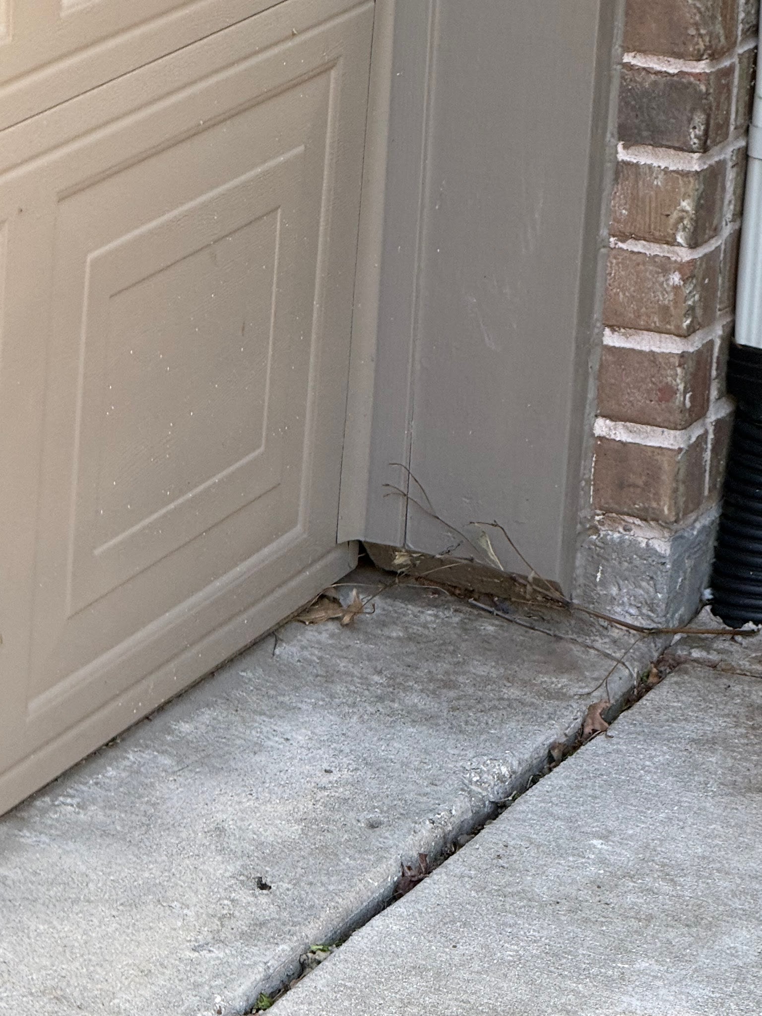 Gap beside a residential garage door