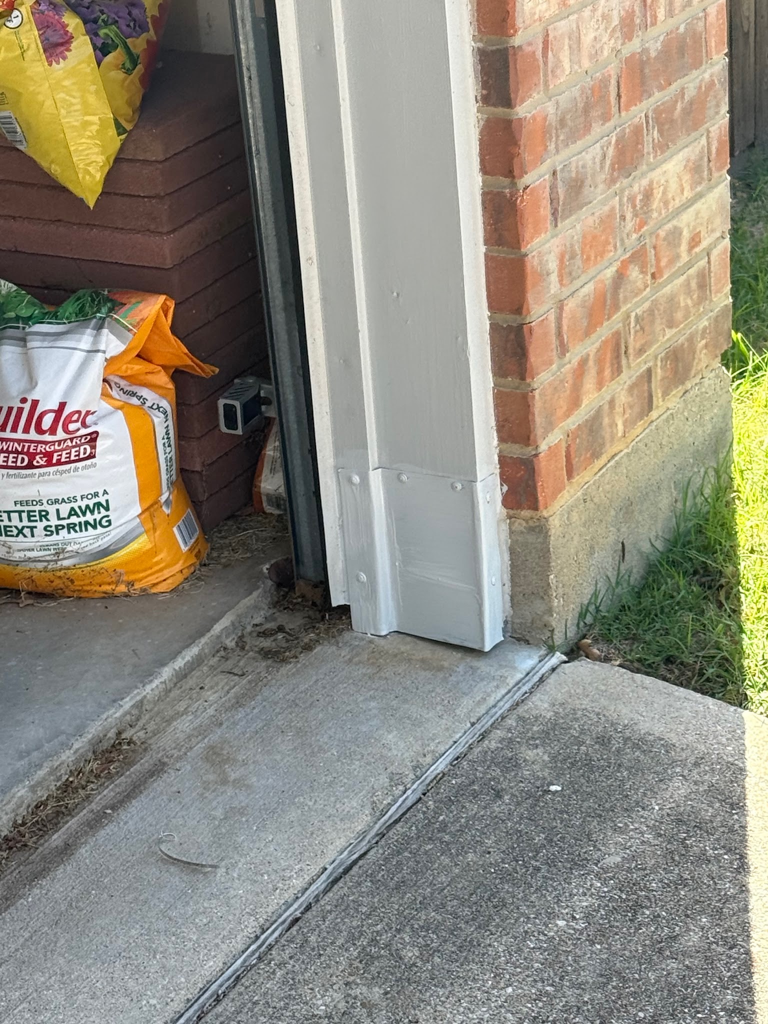 Residential garage door weather stripping and lower door gap