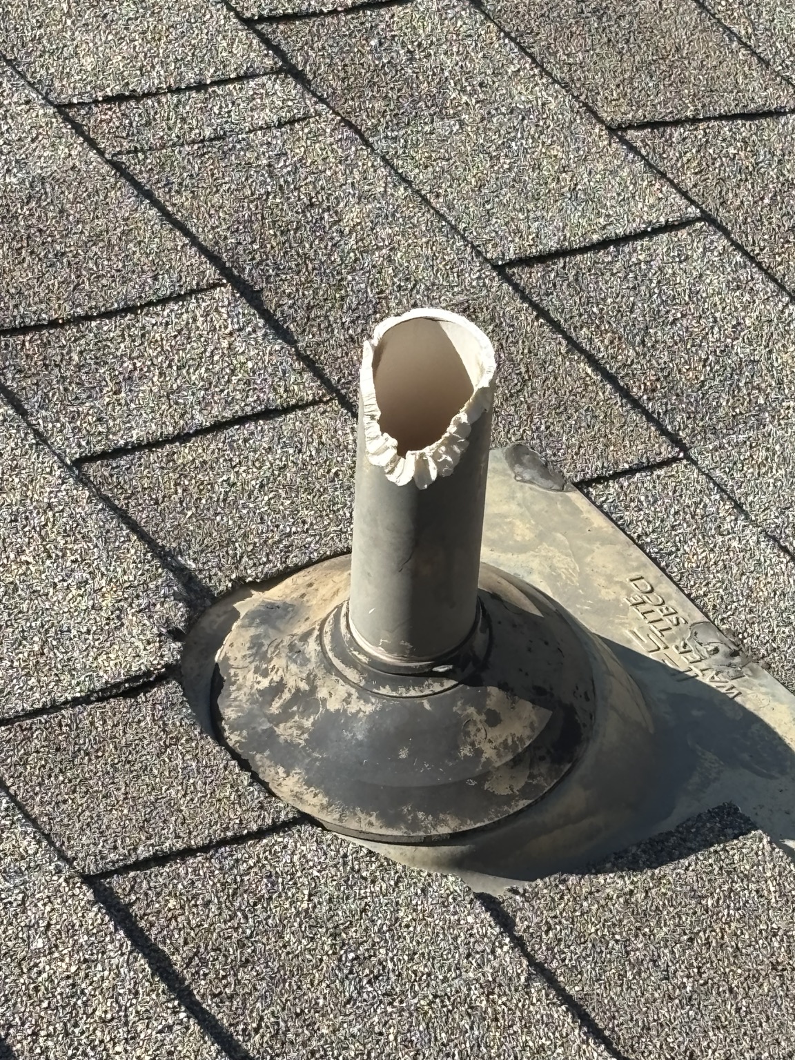 Open plumbing vent on a roof